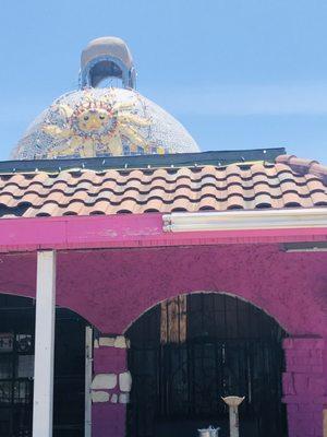 Street side, look for the decorative cupola.