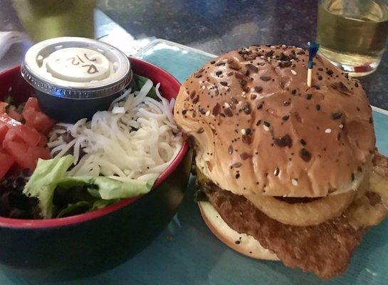 Very delicious pork tenderloin sandwich...served on a fresh tasty bun with and a fresh green side salad.