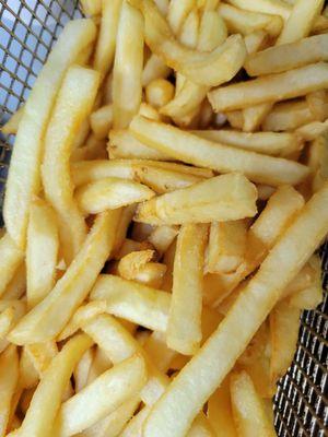 Crispy, hot, and fresh french fries served with salt and pepper.