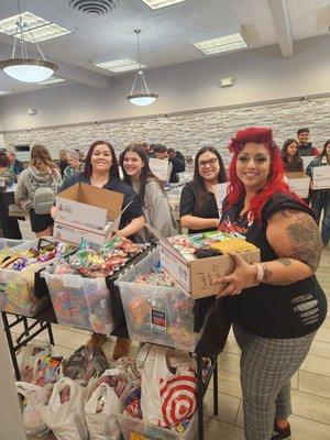 Packing boxes with community members for our deployed troops