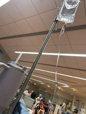 in the waiting room hooked up to an iv