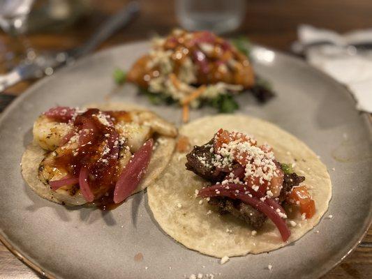 Shrimp taco, chicken empanada, and steak taco.