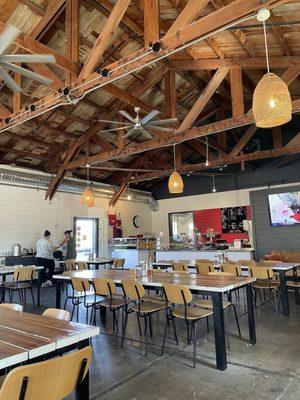 Expansive dining area--love the rustic vaulted ceiling with beams