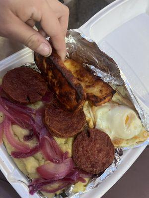 Mangu plate with burnt cheese and sausage