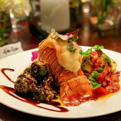 Surf and turf with Chicken Roulade and charred Brussel Sprouts with a balsamic reduction