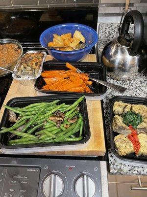 Oyster stuffing, cardamom-maple yams and sweet potatoes, carrots, green beans, artichoke eggplant terrine.