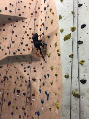 My granddaughter scaling the wall.