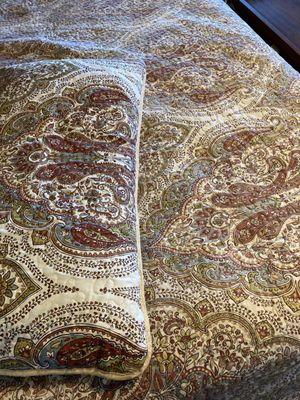 Bedspread.  Sham was not cleaned by them.