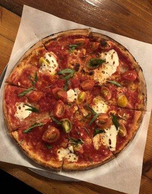 Margherita pizza with cherry tomatoes