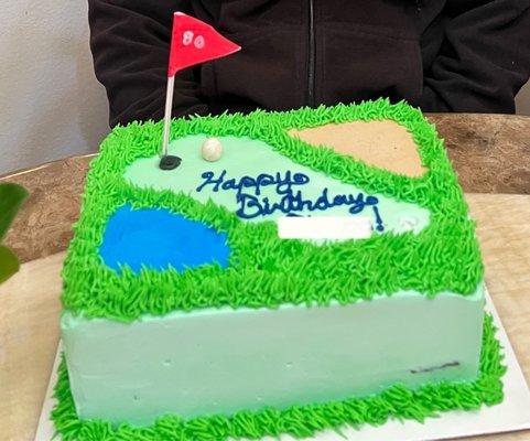 Final cake with the flag pole & golf ball made by yours truly from fondant.