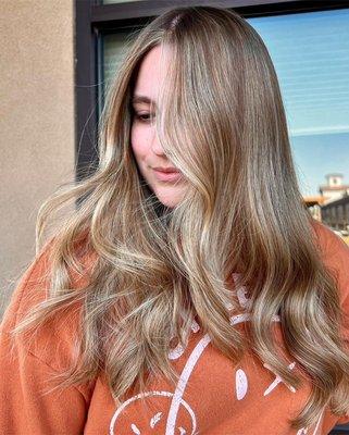 Teasy lights and balayage  adding a more natural texture blonde tones to the hair.