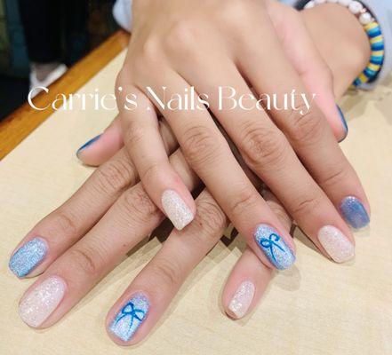 Gel manicure with blue cat eye design