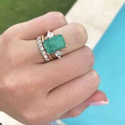 Custom emerald and side pear diamond ring.