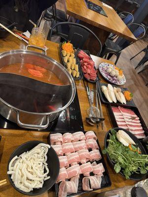 hot pot - half shoyu / thai chili broth, (12.95) with maha sauce. brisket ($22.95) with side of udon and veggies.