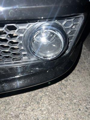 Fog lamp not flush against housing and bulb not up against lens.