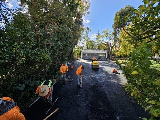 This picture shows our crew paving a residential driveway.