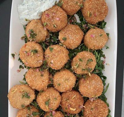 Vegan Krab Cakes made with hearts of palm, garbanzo beans and artichoke then deep-fried and served with a vegan herb aïoli.