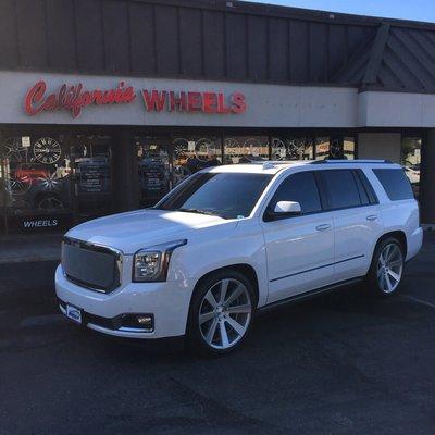 Denali lowered on 24" Dub wheels, custom grille, tinted windows and blacked out trim . All work by California Wheels