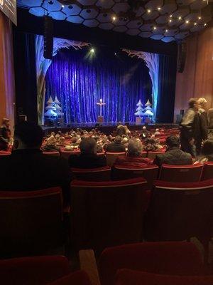 Before curtain up people still getting seated.