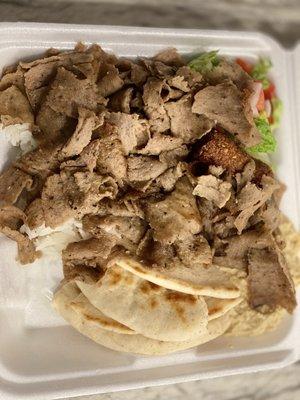 This the gyro platter with hummus and falafel as the sides.