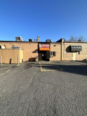 The parking lot & back of the brick building of Hanley Sound currently occupied by Dunkin' Donuts in Medford MA.