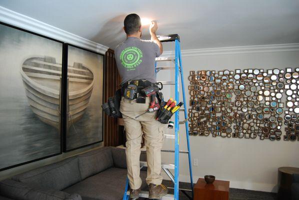 One of our Electricians replacing recessed lighting.