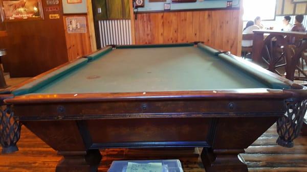 This is the famous pool table that was purchased in 1903 for the bar and is still in use today.