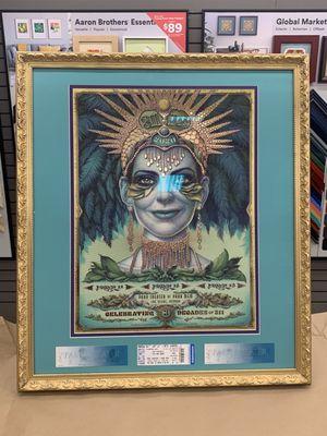 Framed poster, double matted with concert ticket stubs floated at the bottom, conservation glass