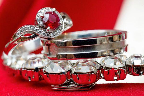 The band with the moat and square cut out is the ring from Diana Vincent. The ring with the ruby is from another establishment.