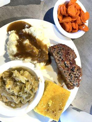 Meatloaf, mashed potatoes, cabbage, carrots and cornbread.