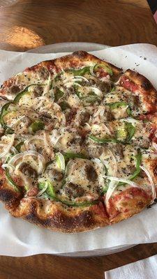 Chicago style pizza- fresh tomato sauce, Italian sausage, green peppers, onions and mozzarella cheese