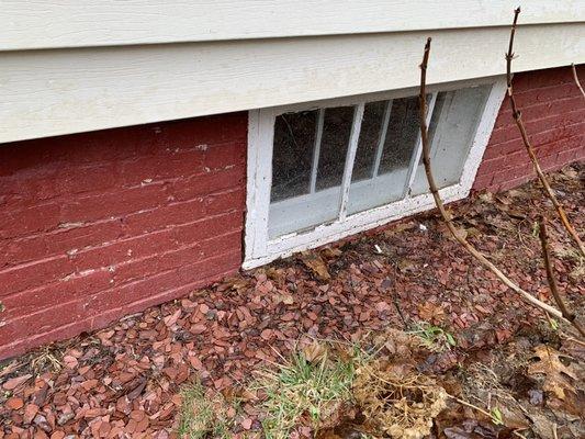 Level grading with basement window sill! In need of a window well grading needs to slope away from the foundation.