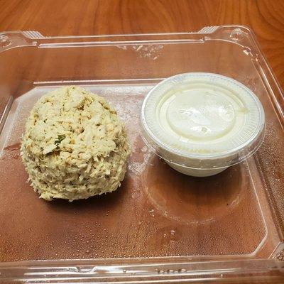 The scoop of tuna is as small as the dressing container.