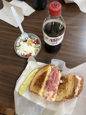 Reuben with cucumber salad.