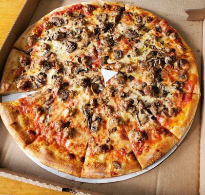 Large sausage and mushroom pizza