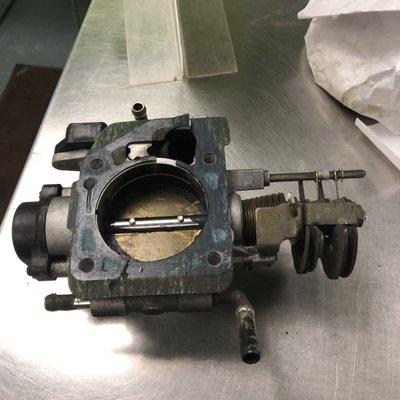 Worn and broken throttle body