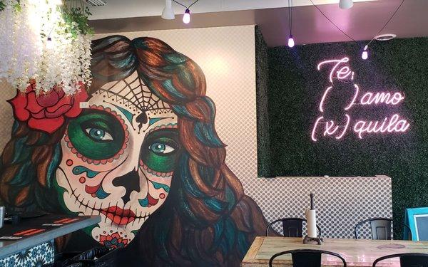 LOVE the colorful wall mural, LOVE the "te amo/tequila" neon sign. The vibes in here are really nice