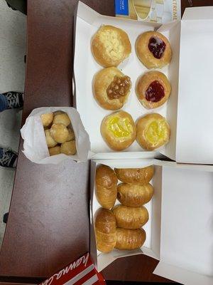 Assorted fruit kolache and small sausage kolaches with a small bag of donut holes