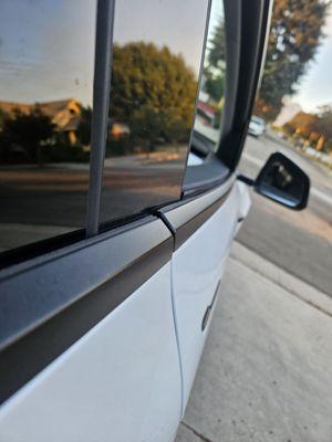 My front door, does my door look misaligned? Well it is and from the rear, my Tesla looks like it came from Car Star Douglas!