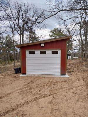 After: 24gauge commercial door with battery backup and a full built garage