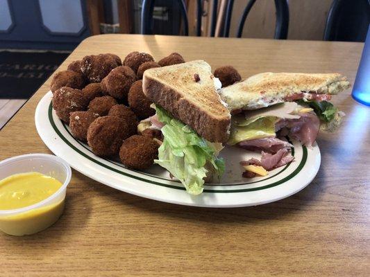 Club sandwich and breaded mushrooms