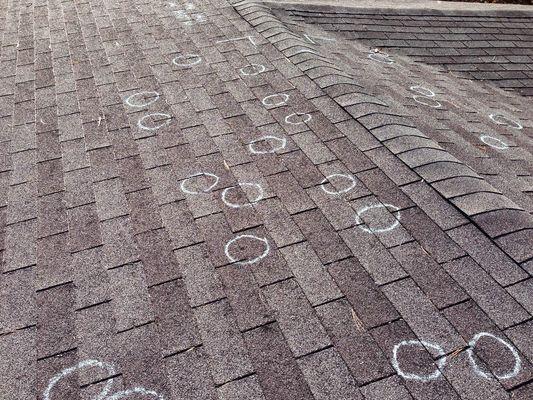 We are outstanding at working with your insurance company. Pictured here is a roof marked up by an adjuster showing hail hits on a local roo