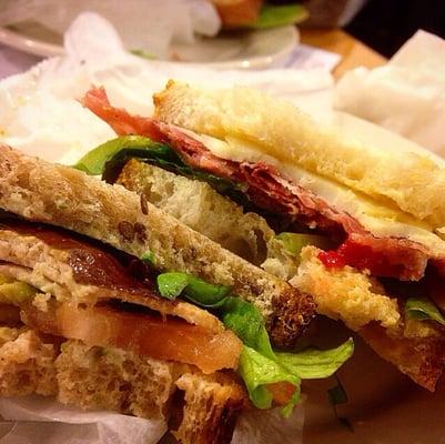 Bottom: grilled chicken with herb mayo & avocados on whole wheat ($8). Top: sopressata with fontina, Dijon mustard on white ($9)