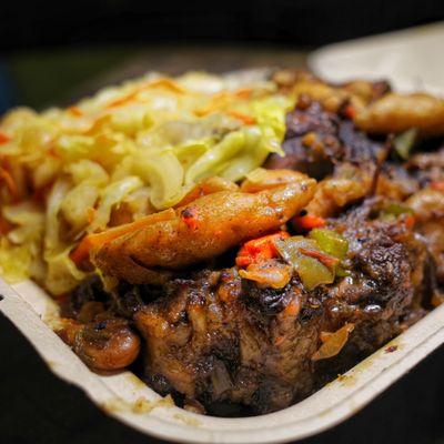 oxtail stew with dirty rice and cabbage. This is so good. Definitely worth a try.