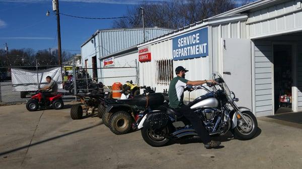 Taking care of my bike. Getting tire put on back. They say it doesn't take long for them to change one over.