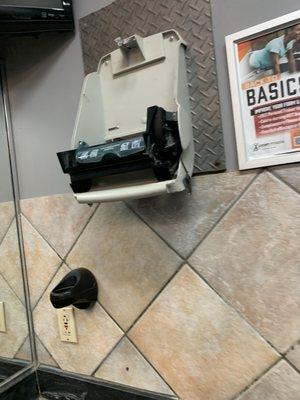 Broken paper towel dispenser been like this for over a month