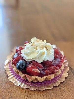 Cherry tart filled with whipped cream