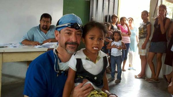 Dr. Barack performing charitable dental procedures in Honduras