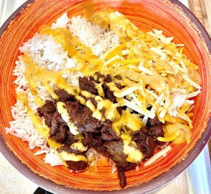 White rice, steak, queso, cheese.