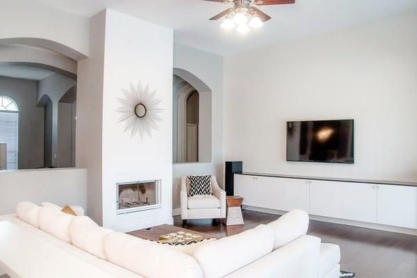 AFTER - modernized filled out fireplace with custom built in entertainment center